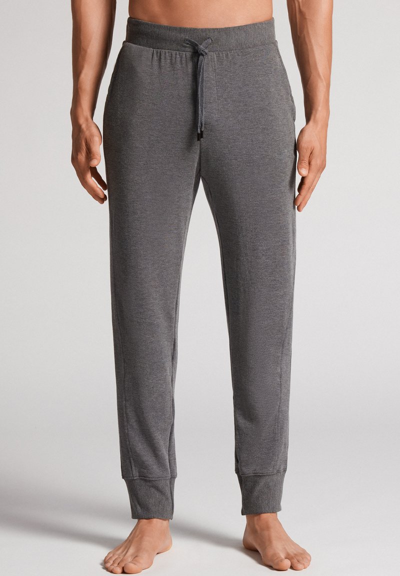 Grijze katoenen joggingbroek met een trekkoord in de taille, taps toelopende benen en geribde boorden. Zachte textuur, geschikt voor casual wear of om in te relaxen.