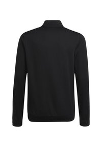 Svart långärmad jacka med en något högre krage, slät textur, inga synliga mönster och elastiska muddar vid handleden.