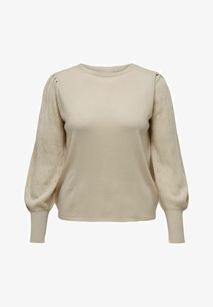 Bež pulover iz pletene tkanine z kratkimi, napihnjenimi rokavi in cvetličnim očesnim vzorcem ter rebrastim ovratnikom in manšetami. Mehka tekstura po celotni površini.