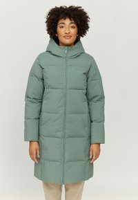 Padded green long coat with a hood, zip closure, and side pockets. Smooth texture with stitched squares and subtle branding on the chest.