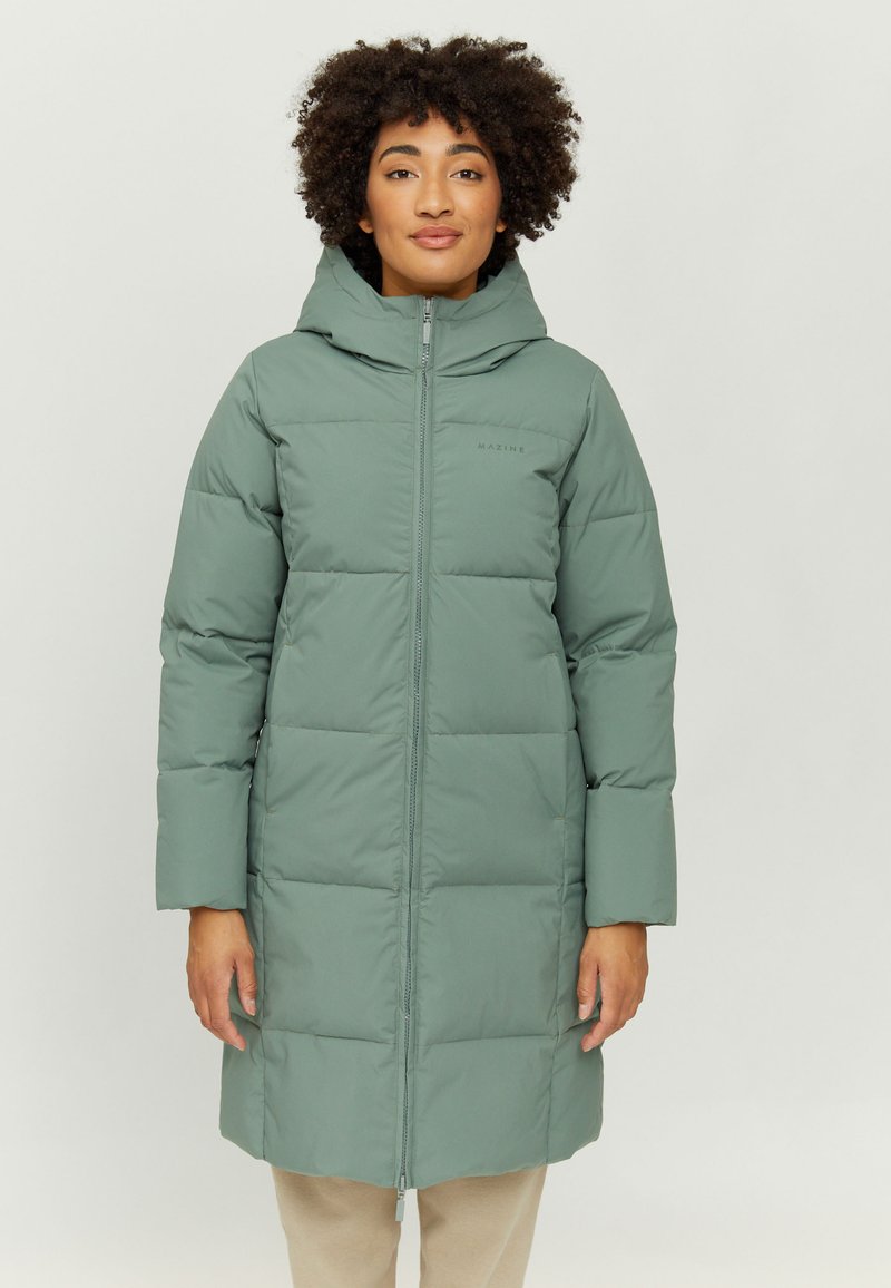 Padded green long coat with a hood, zip closure, and side pockets. Smooth texture with stitched squares and subtle branding on the chest.