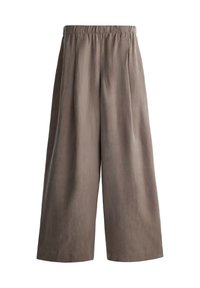 Pantalon court ample marron avec une taille élastique et des jambes larges, fabriqué dans un tissu doux et léger.