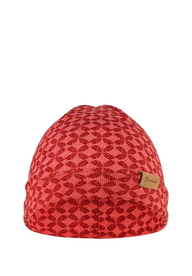 Red beanie hat with geometric pattern, textured fabric, and a small brown tags on the side, showcasing a snug fit and rounded shape.