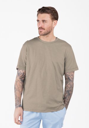 Olive green short-sleeve t-shirt with a crew neck, made from soft fabric; features relaxed fit and smooth texture, paired with light blue shorts.
