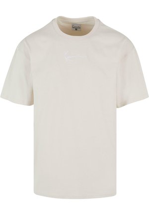 Short-sleeve, crew neck t-shirt in cream cotton with a subtle white embroidered logo on the chest and a relaxed fit.
