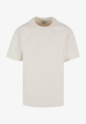 Lühikeste varrukatega, ümmarguse kaelusega t-särk koorevärvi puuvillast, millel on rindkeres peen valge tikkimisega logo ja mugav lõige.