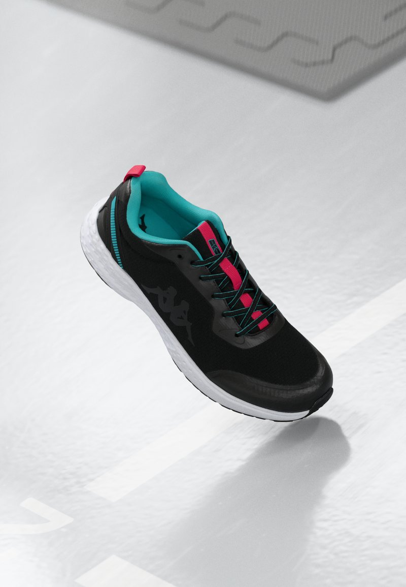 Black athletic shoe with turquoise lining and pink accents. Features a textured upper, thick white sole, and contrasting laces.