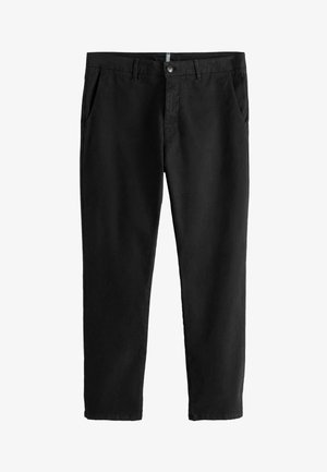 Černé kalhoty z bavlny se střihy rovného nohavice, s dvěma předními kapsami a pasem se zapínáním na knoflík a zip.