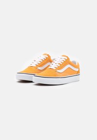 Orange suede sneakers with white laces, featuring a white side stripe and black sole. Classic design, low-top shape, textured finish.