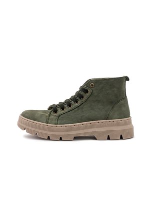 Green suede ankle boot with rounded toe, metal eyelets, and thick, textured beige sole featuring deep grooves for traction.