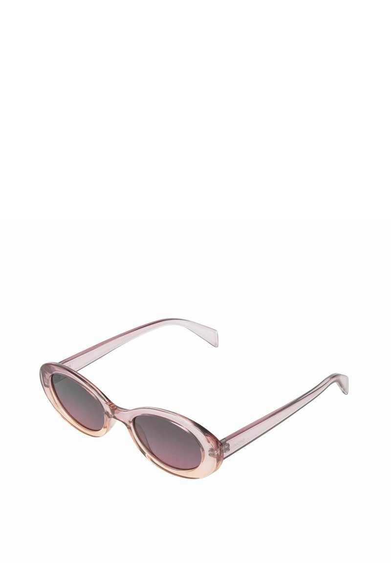 Lunettes de soleil ovales avec des montures transparentes roses, des verres dégradés gris et des branches fines. Remarquables par leur design minimaliste et leur dégradé de couleurs doux.