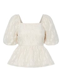 White puff-sleeve top with a square neckline, featuring a textured floral pattern and a gathered peplum hem.