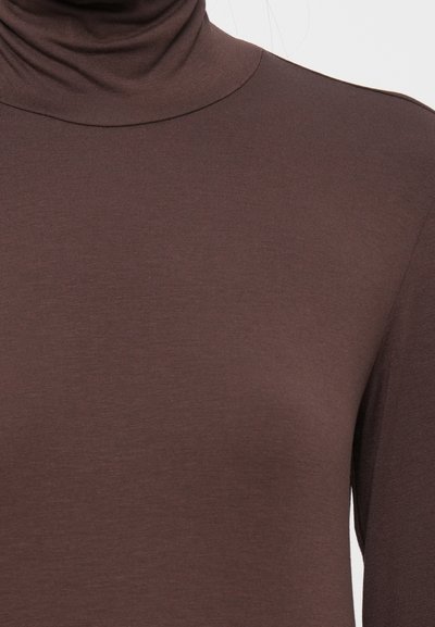Brown turtleneck top made of soft, stretchy fabric. Features a high neck and long sleeves, with a smooth texture and fitted silhouette.