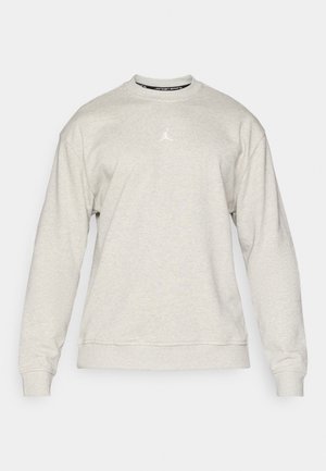 Sweatshirt gri deschis dintr-un material moale, cu guler rotund și manșete ribbate. Logo-ul alb Air Jordan centrat pe piept. Design simplu.