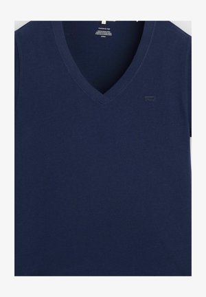 Navy blue V-neck short-sleeve cotton T-shirt with small Levi's logo on left chest and size label inside neckline.