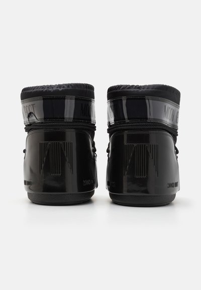 Black waterproof boots with glossy finish, padded collar, looped laces, and embossed branding on heels and sides. Rubber soles for traction.