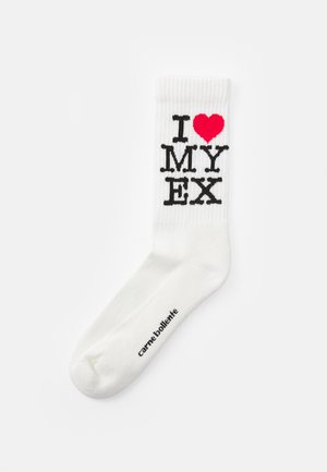 White socks with ribbed texture featuring the text "I ❤️ MY EX" in black and a red heart. Small black branding on the sole.