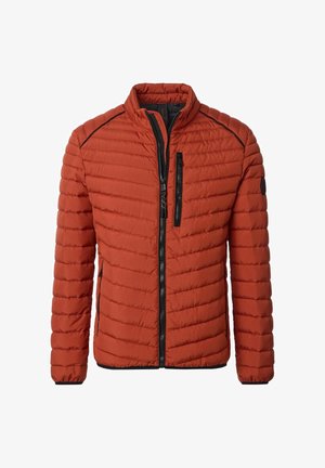 Rust-colored quilted jacket with black zipper, chest pocket, and black piping details on shoulders and sleeves.