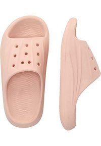 Lyserøde slip-ons lavet af letvægtsmateriale, med perforerede huller og en tekstureret indersål for godt greb. Buet, strømlinet form.