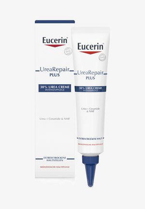 Eucerin UreaRepair Plus Creme Tube mit blauen Akzenten, beschriftet mit "30% Urea Creme", neben einer passenden Box. Beide sind weiß mit roten und blauen Schriftzügen.