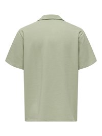 Light green textured short-sleeve shirt with a collar, shown from the back on a white background.