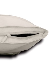 Beige zippered cushion cover featuring a textured fabric, with a visible zipper closure along one edge and a smooth surface.