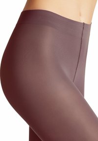 Collant opachi di colore mauve con una texture liscia. Presenta un ampio elastico in vita e dettagli delle cuciture sottili lungo il lato.