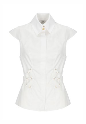 Blusa bianca donna senza maniche con colletto appuntito, bottoni frontali e cinturini laterali regolabili con fibbie dorate.