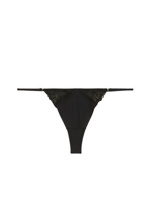 Culotte string noire avec des accents en dentelle à l'avant, tissu lisse, fines bretelles et un design offrant une couverture minimale à l'arrière.