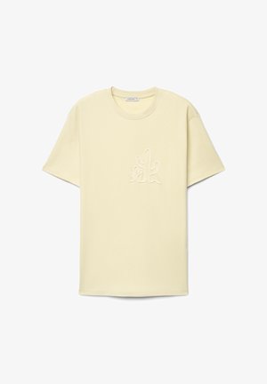 Hellbeiges T-Shirt mit kurzen Ärmeln, Rundhalsausschnitt und erhabenem Kaktus-Design auf der Brust, Markenetikett innen am Kragen.