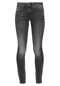 Černé úzké džíny z denimu. Vyprané s jemnou texturou. Mají pět kapes a zapínání na knoflík se zipem.