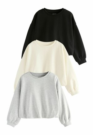 Drei Rundhals-Sweatshirts in Schwarz, Creme und Grau. Jedes verfügt über lange Ärmel, gerippte Bündchen und eine lockere Passform. Weicher Stoff.