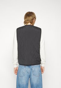 Puma DOWNTOWN PADDED GILET - Smanicato - black