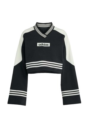 Sweatshirt noir raccourci avec des accents blancs. Il présente un col en V, des manches longues et trois bandes horizontales le long des poignets. Logo centré sur la poitrine.