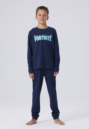Haut à manches longues bleu marine avec un graphisme "FORTNITE" et des accents de flamme, associé à un pantalon bleu marine assorti, fabriqué en tissu doux.