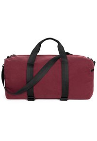 Borsa a sacca bordeaux realizzata in tessuto testurizzato. Presenta spallacci neri regolabili e due manici superiori. Chiusura con zip per il compartimento principale.