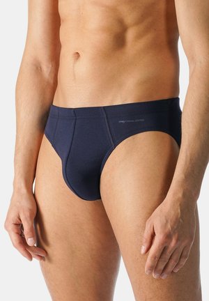 Marineblauwe katoenen slips met een gladde textuur, contrasterende naden en een logo op de tailleband. Ontworpen voor een snug fit en comfort.