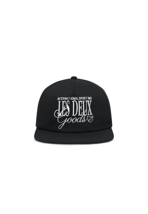 Black snapback cap with a flat brim. Features embroidered white text "INTERNATIONAL SPORTING LES DEUX Goods" and a shield logo.