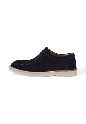 Navy blue suede lace-up casual shoe with white sole and brown stitching, shown in side profile on white background.