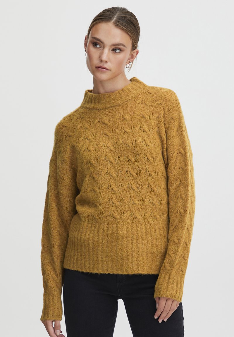 Senfgelber gestrickter Pullover mit einem strukturierten Muster, hohem Kragen und geripptem Saum. Verfügt über lockere Ärmel und hat ein weiches, warmes Erscheinungsbild.