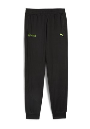 Pantalon de survêtement Puma noir avec taille élastique, poches latérales zippées et logos verts Mercedes AMG Petronas et Puma sur le devant.