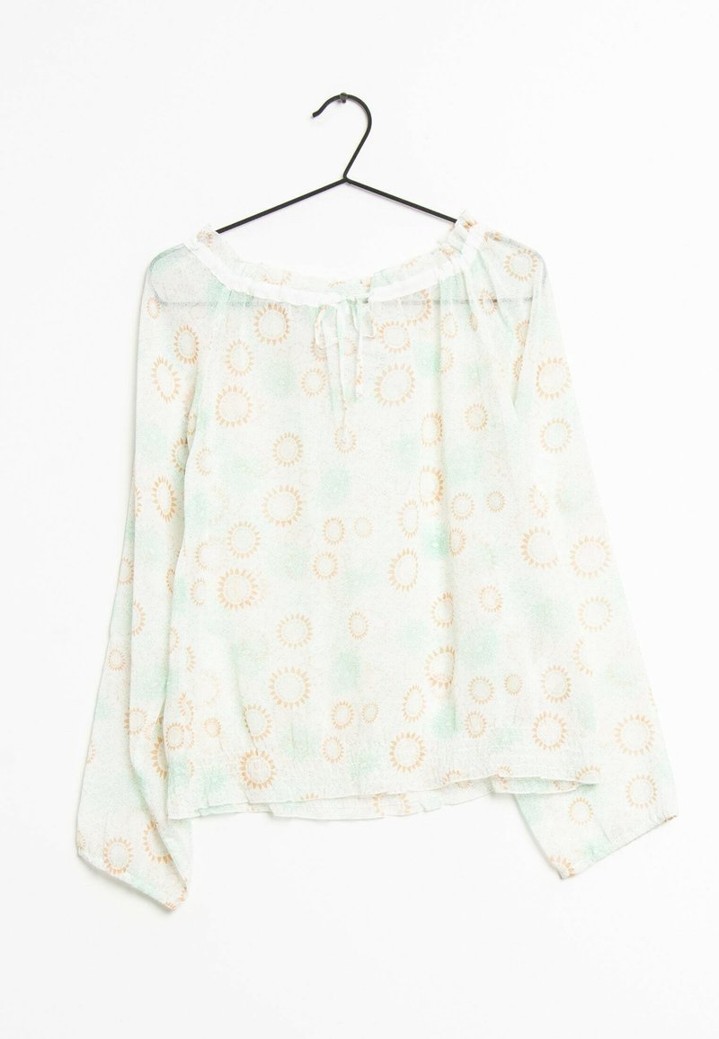Lightweight, green blouse with long sleeves, an off-shoulder neckline, and repeating sunburst patterns in beige. Finished with a tie at the neck.