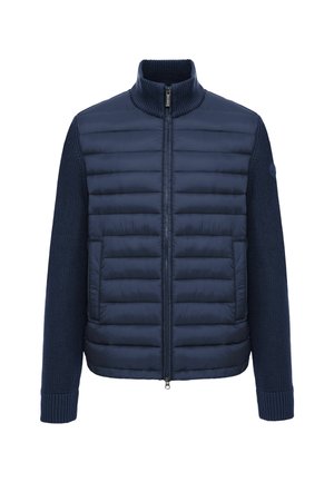 Veste homme bleu marine avec devant matelassé et manches tricotées, fermeture éclair, col montant et deux poches avant.