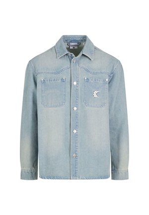 Light blue denim jacket with long sleeves, two chest pockets, silver buttons, and a small logo patch on the left pocket.