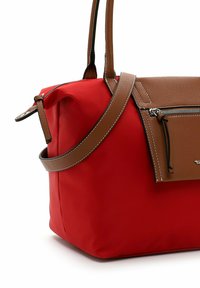 Red nylon handbag with a brown leather accent and strap. Features a front zip pocket and contrasting stitching on the leather.