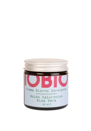 Barattolo di vetro marrone con un coperchio a vite argentato. L'etichetta presenta un testo audace rosso e verde su uno sfondo azzurro chiaro. Contiene 50 ml di crema.