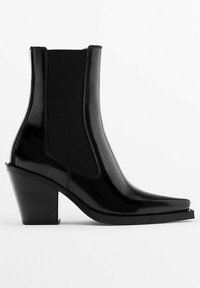 Black ankle boots with a glossy finish, square toe, elastic side panels, and a chunky heel. Made from synthetic material.