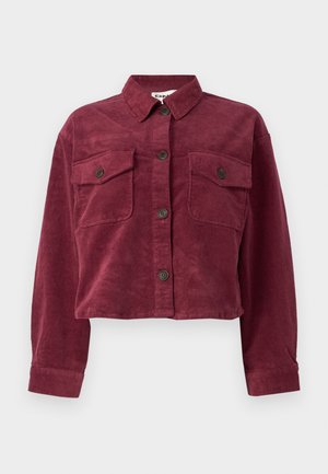 Burgundy corduroy cropped jacket with a collar, two front pockets, and button closure. Features textured fabric and long sleeves.