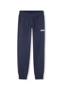 Pantalon de survêtement marine en tissu doux, avec une taille élastique, deux poches latérales et un logo "BOSS" blanc sur la cuisse gauche.