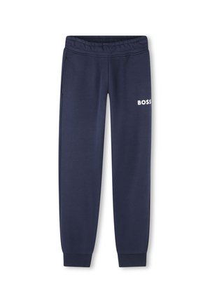 Pantalon de survêtement marine en tissu doux, avec une taille élastique, deux poches latérales et un logo "BOSS" blanc sur la cuisse gauche.